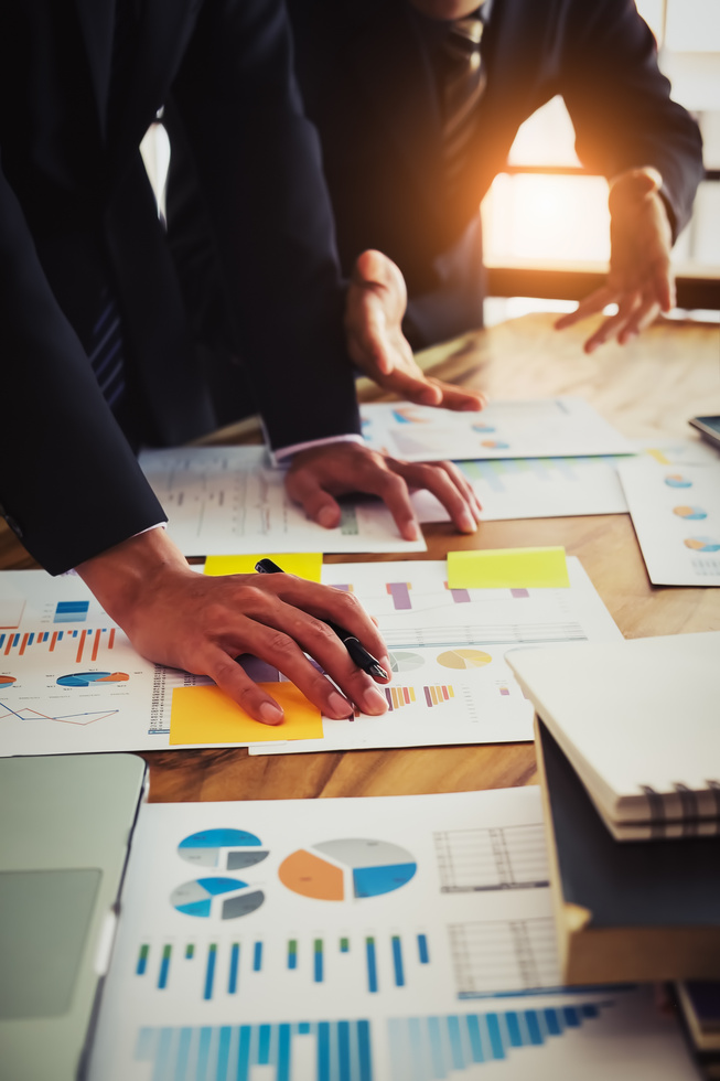 Business Man Pointing to Financial Graph in the Conference.